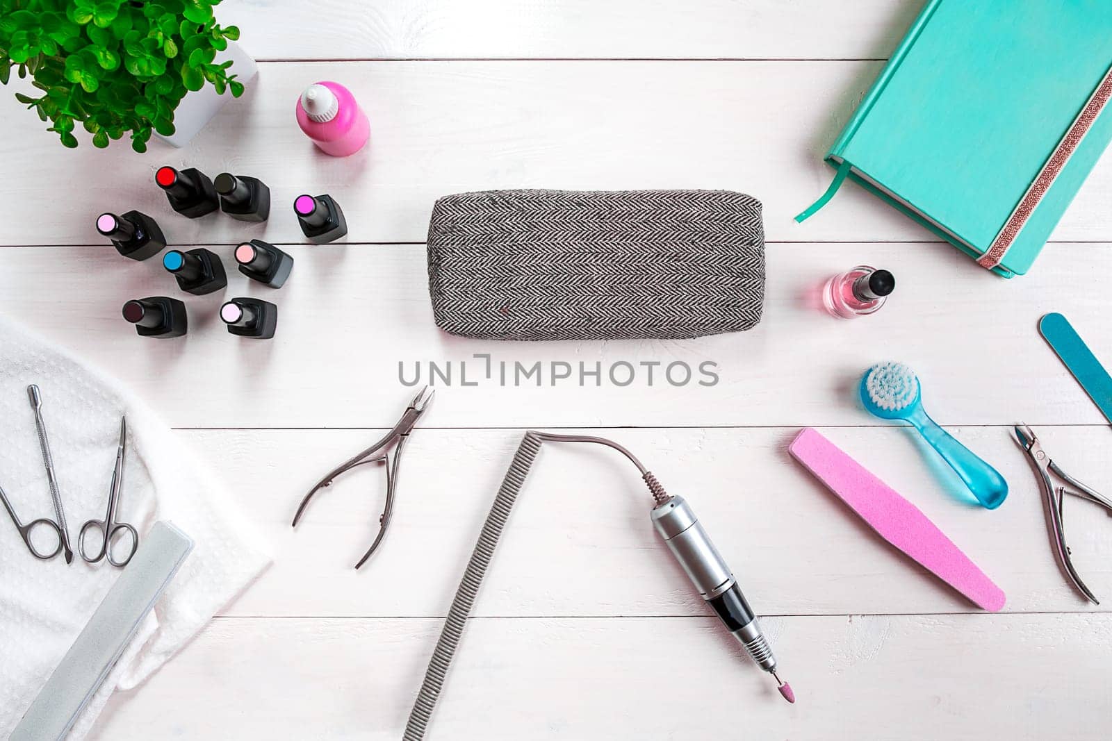 Manicure set and nail polish on wooden background. Top view. Copy space. Still life. Nail Care.