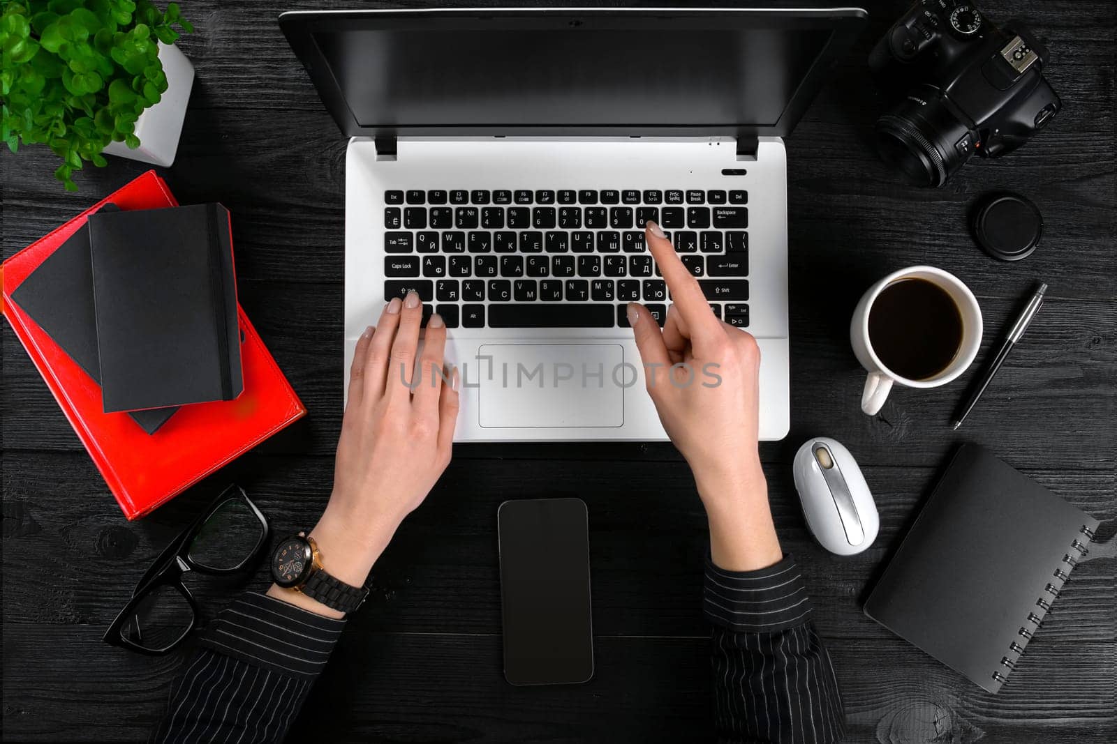 Overhead view of businesswoman working at computer in office. Place for your text. Ideal for blog. Flat lay. Black background