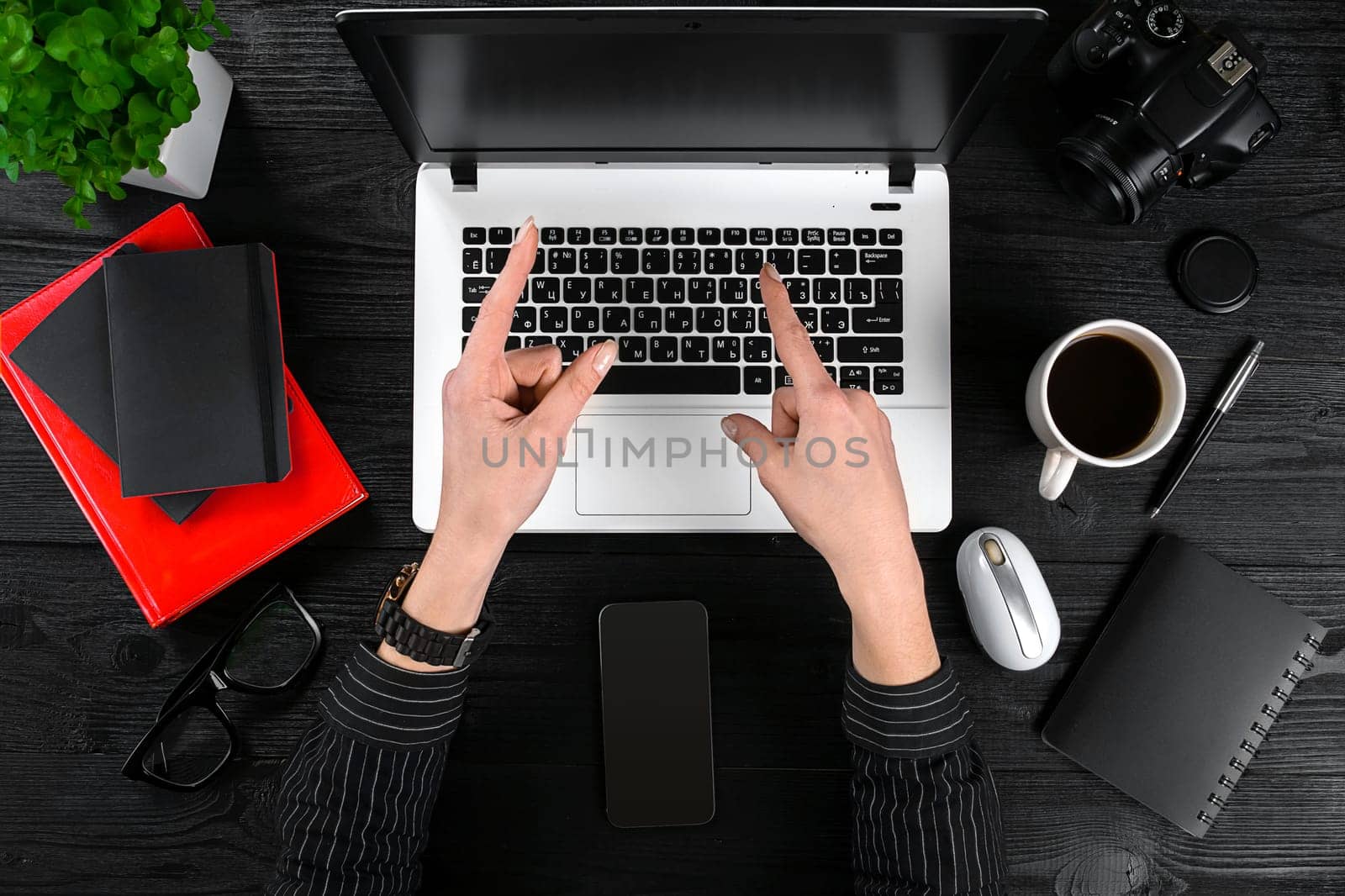 Overhead view of businesswoman working at computer in office. Place for your text. Ideal for blog. flat lay on black background