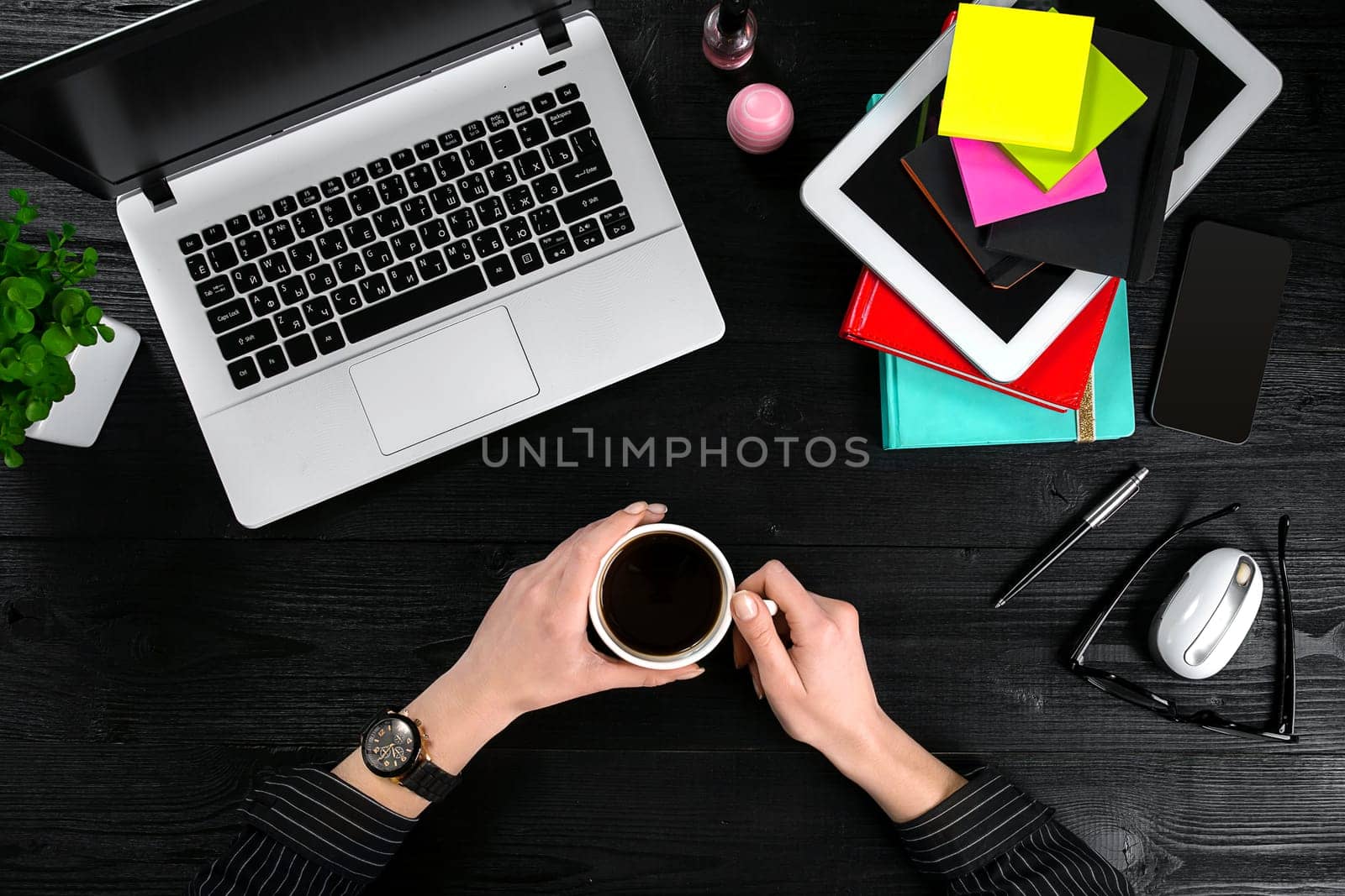 Overhead view of businesswoman working at computer in office. Place for your text. Ideal for blog. flat lay on black background