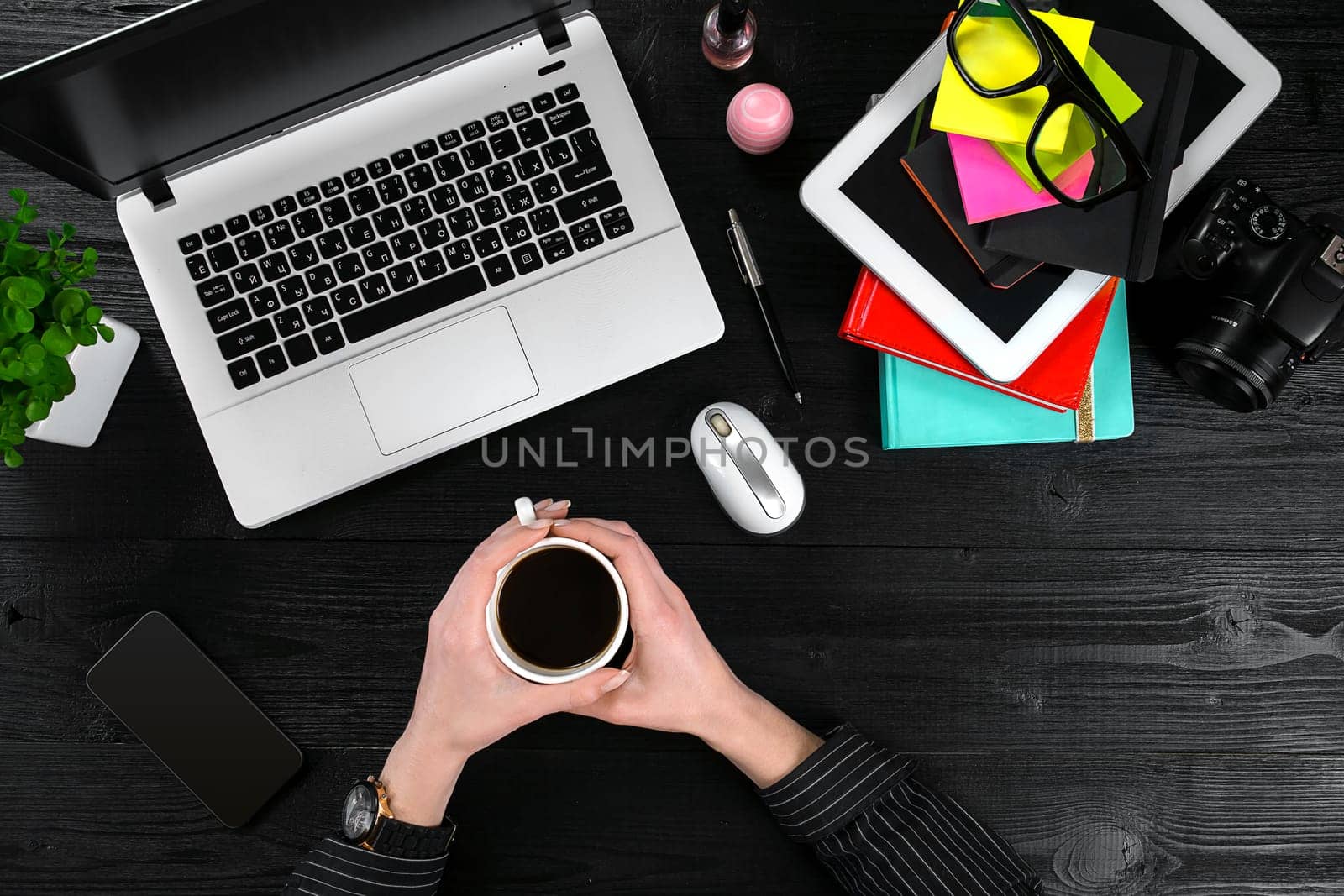 Overhead view of businesswoman working at computer in office. Place for your text. Ideal for blog. Flat lay. Black background