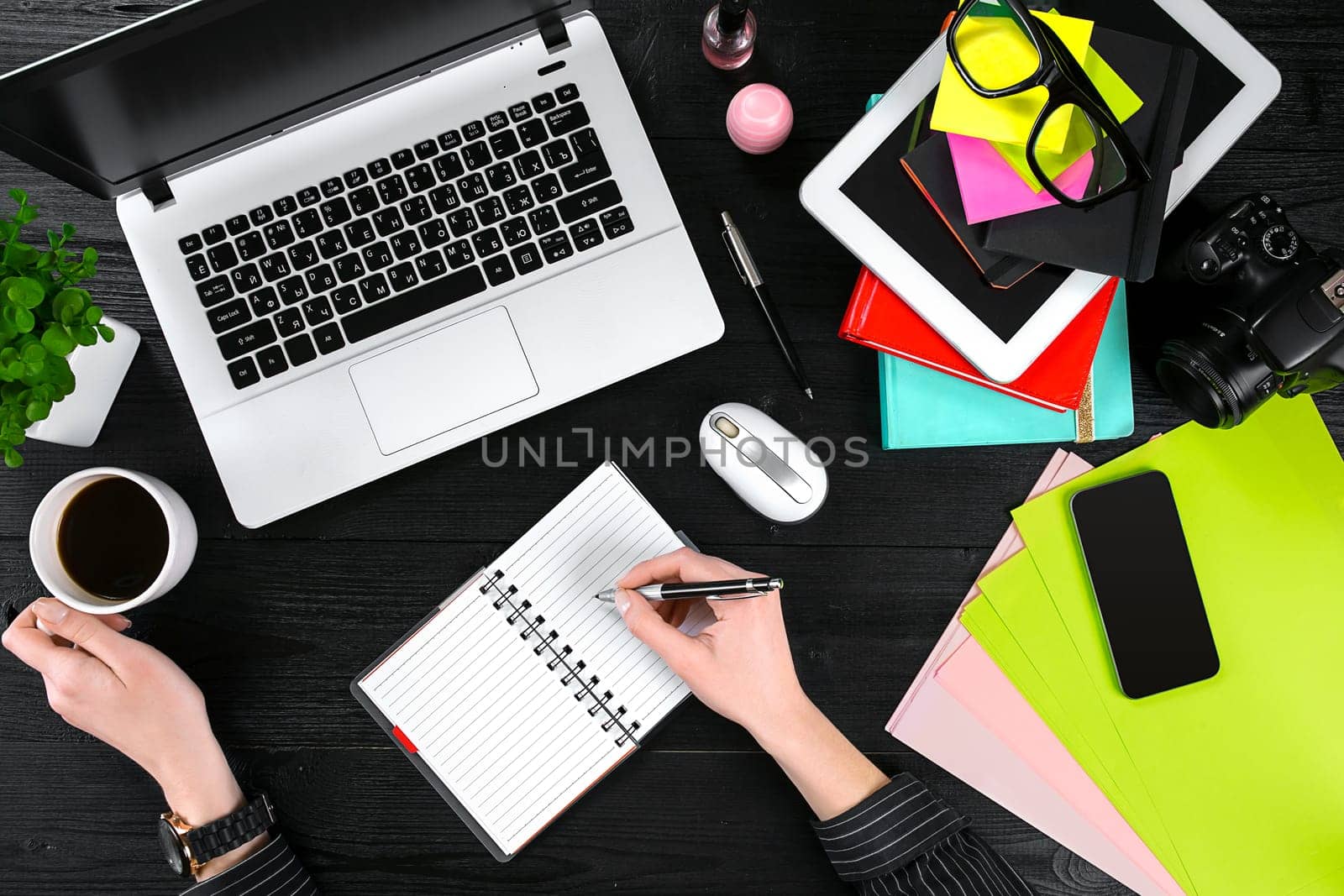 Overhead view of businesswoman working at computer in office. Place for your text. Ideal for blog. flat lay on black background