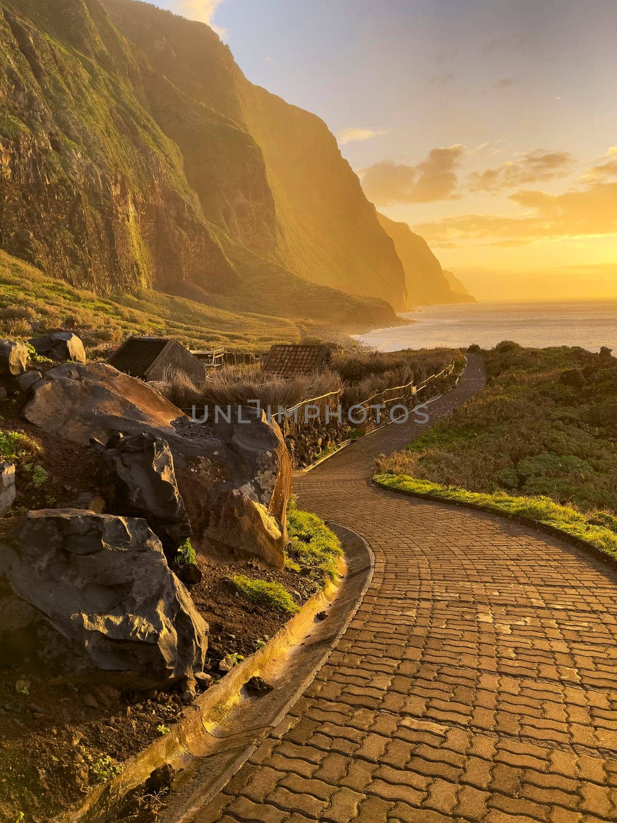Achadas da cruz village stone path sunset view in Porto Moniz district, Madeira, Portugal