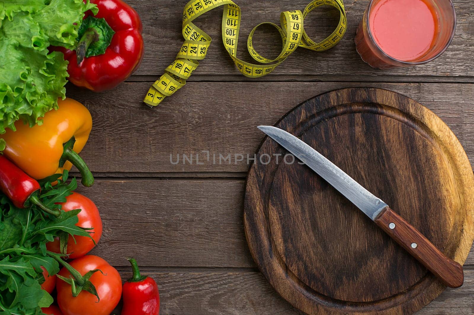 Sport and diet. Vegetables and centimeter. Peppers, tomatoes, salad on rustic background. Top view. Copy space