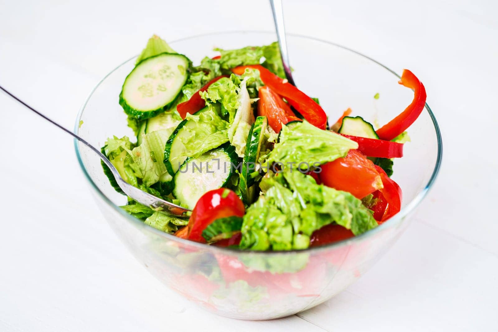 Healthy eating, vegetarian food, dieting and people concept - close up vegetable salad with olive oil on a white background