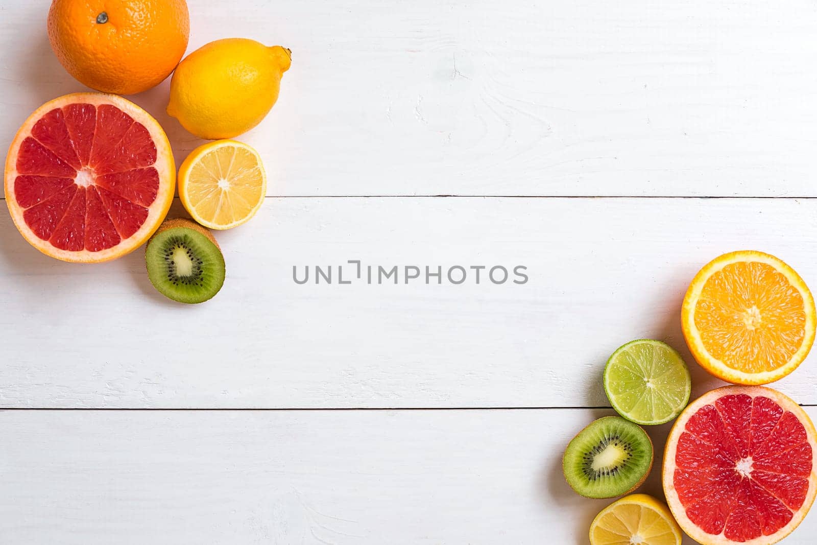 Various citrus fruits on the table. Top view. Copy space.
