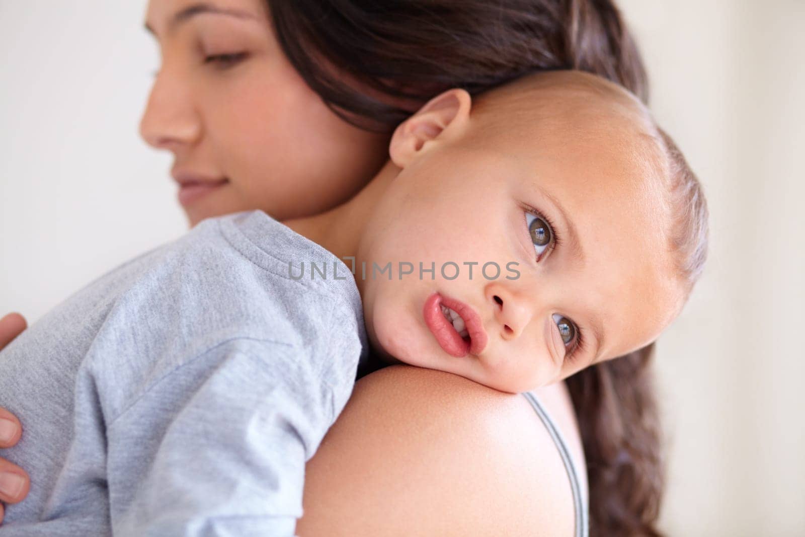 Just me and my baby. a beautiful young woman and her baby at home. by YuriArcurs