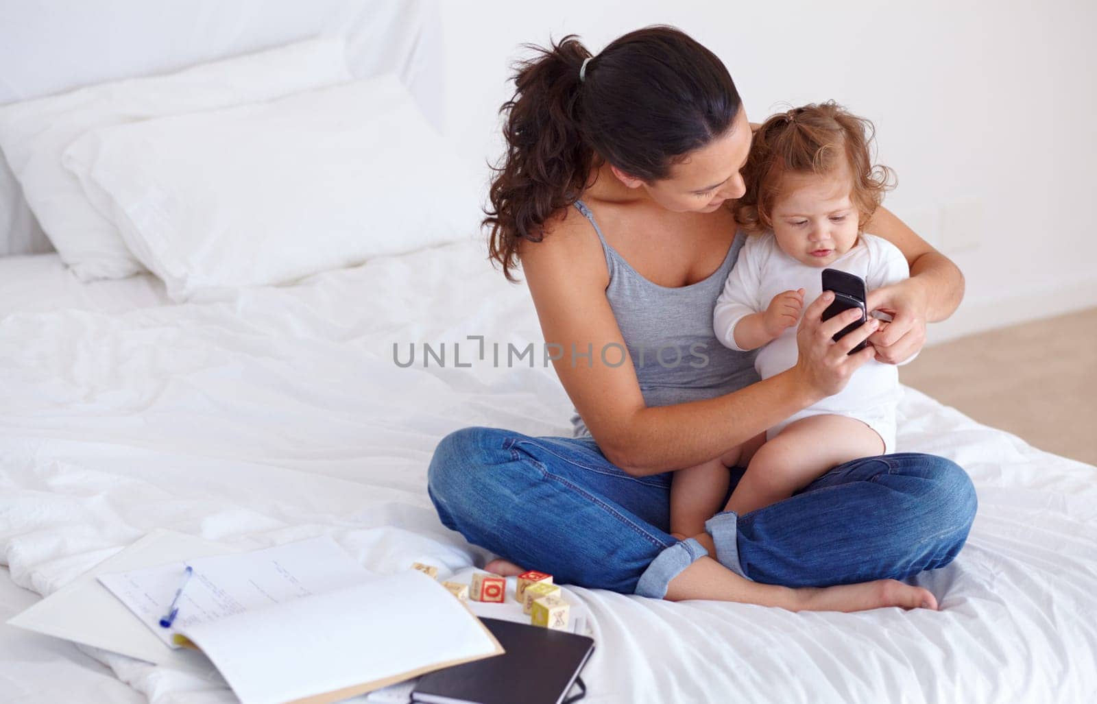 Just me and my baby. a beautiful young woman and her baby at home