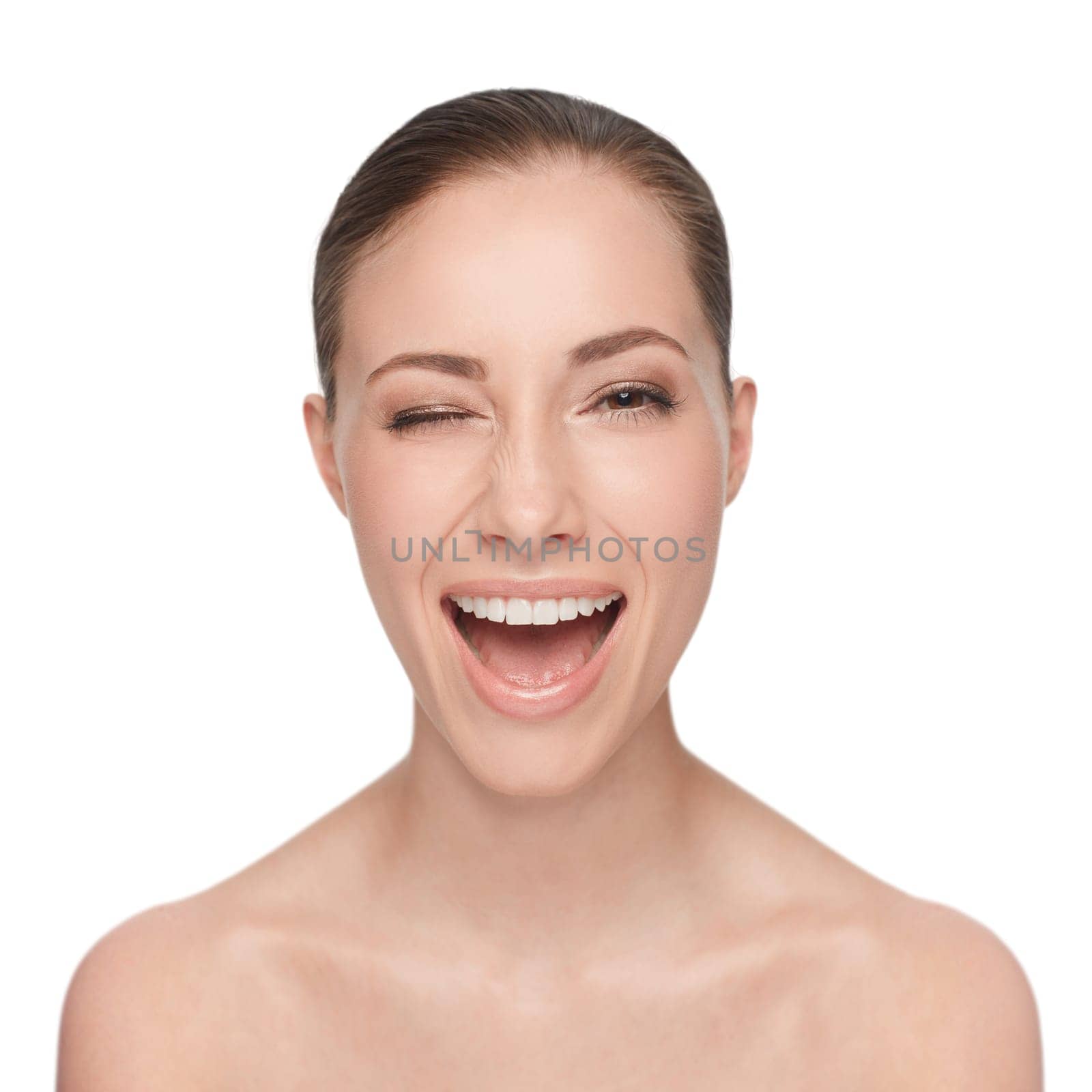 Just for you. Studio beauty portrait of an attractive woman winking at the camera