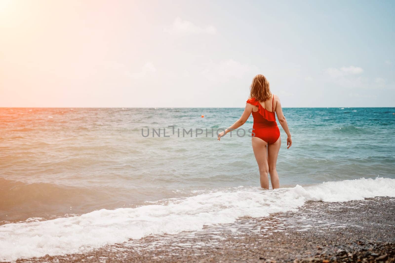 Happy loving family mother and daughter having fun together on the beach. Mum playing with her kid in holiday vacation next to the ocean - Family lifestyle and love concept by panophotograph