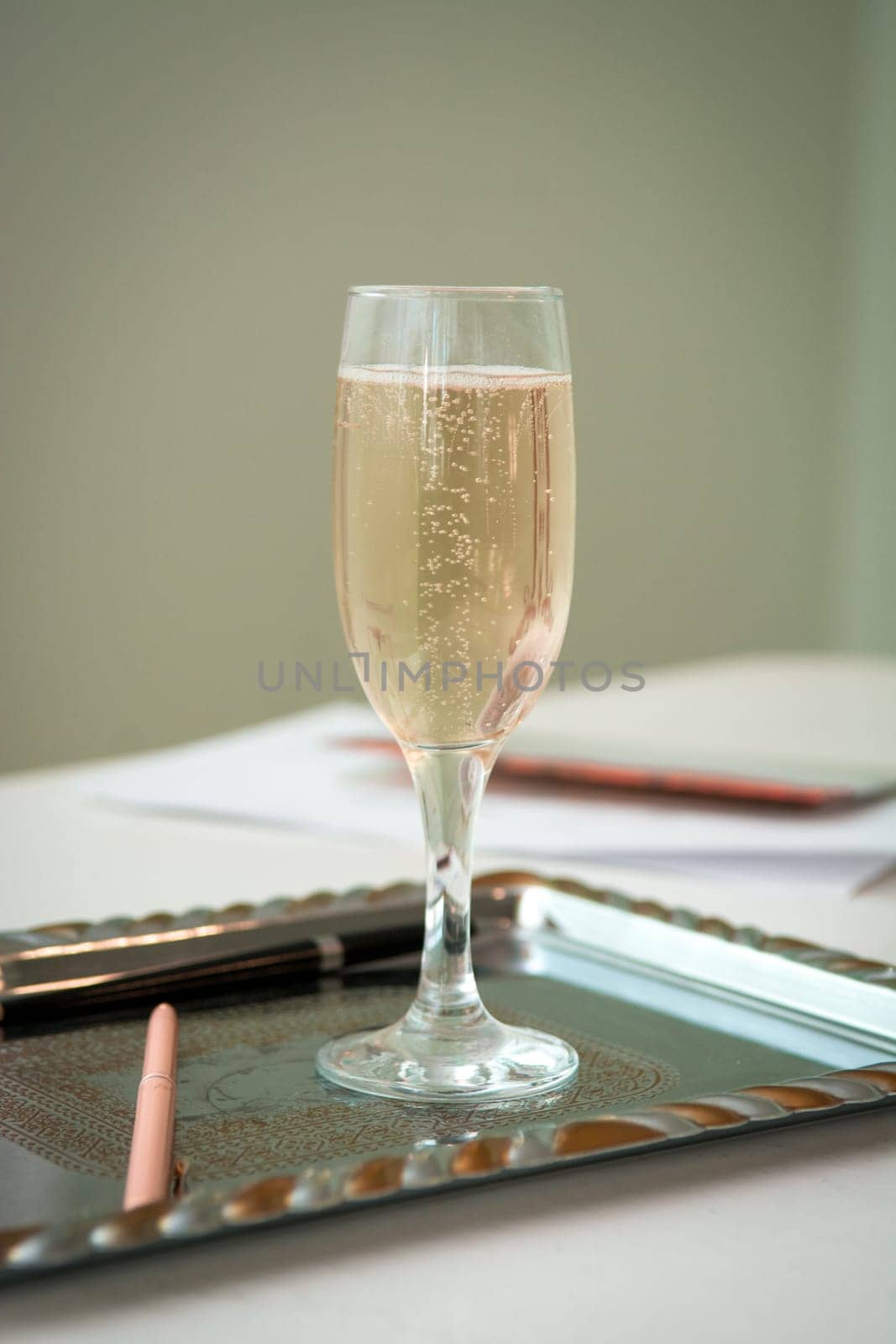 Wedding glass of champagne on the desk