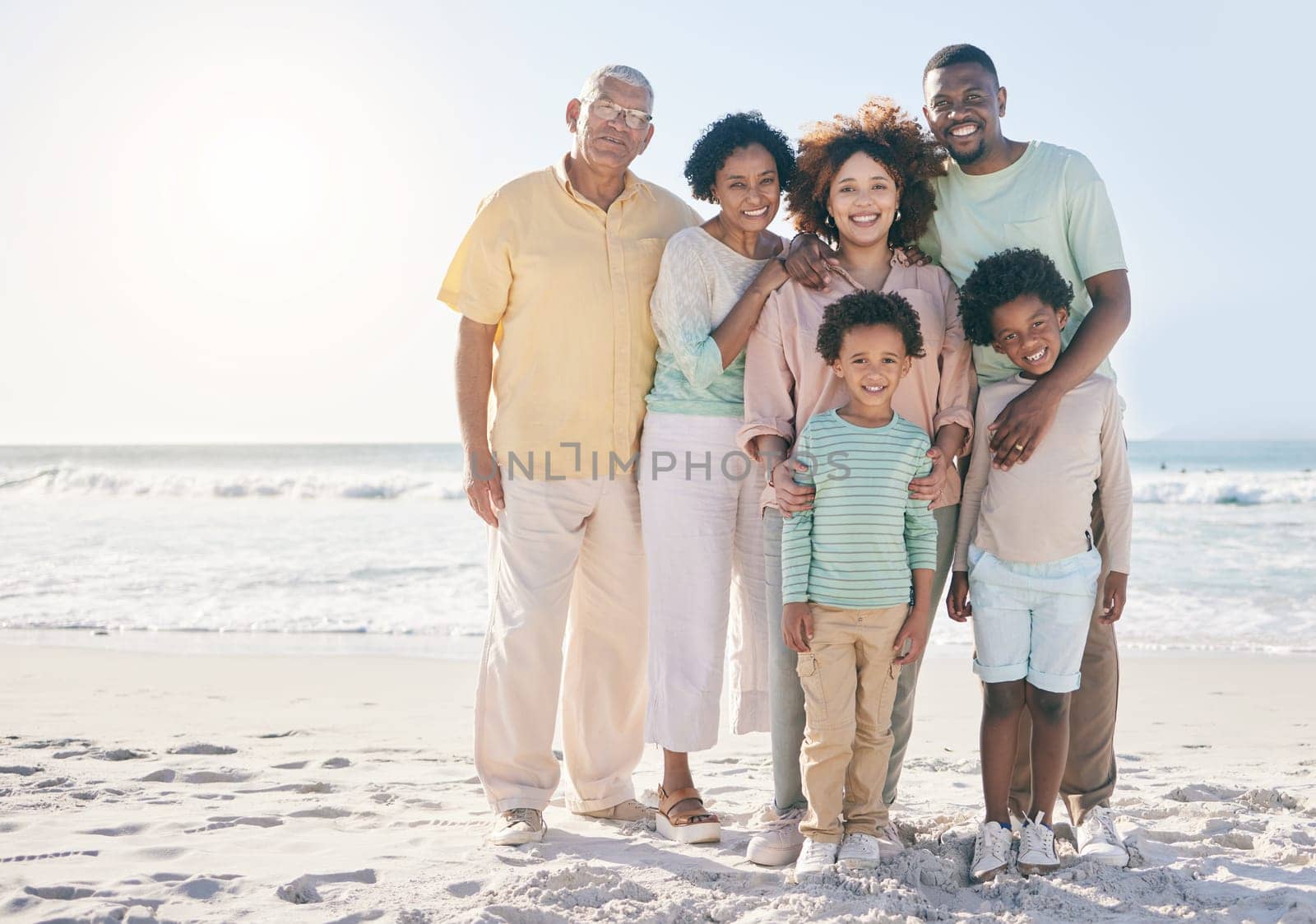 Smile, hug and portrait of a happy family at a beach for travel, vacation and holiday on nature background. Relax, face and trip with children, parents and grandparents bond while traveling in Cancun by YuriArcurs