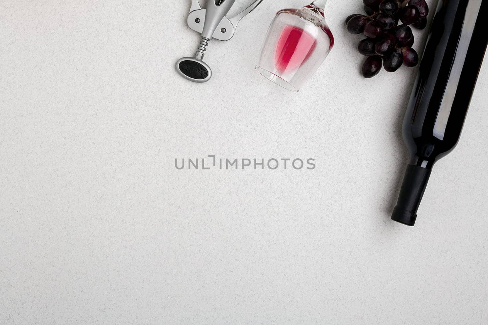 Bottle of red wine with glasses on white background. Mock-up. Top view with copy space. Flat lay