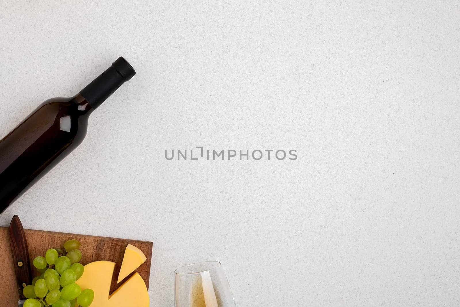 Wine, glasses and corkscrew over white background. Top view with copy space