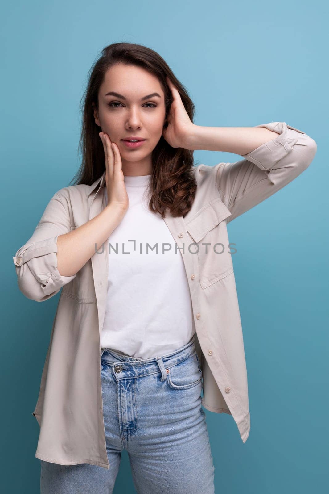 charming young brunette female adult in casual shirt.