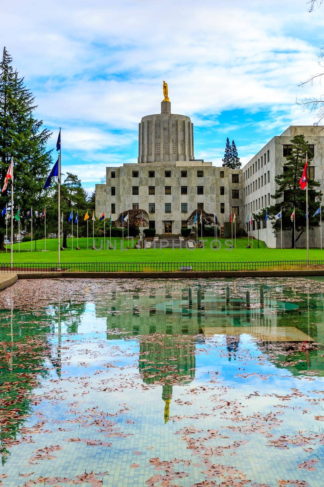 Oregon State Capitol building in Salem, Oregon, with reflection in the pool