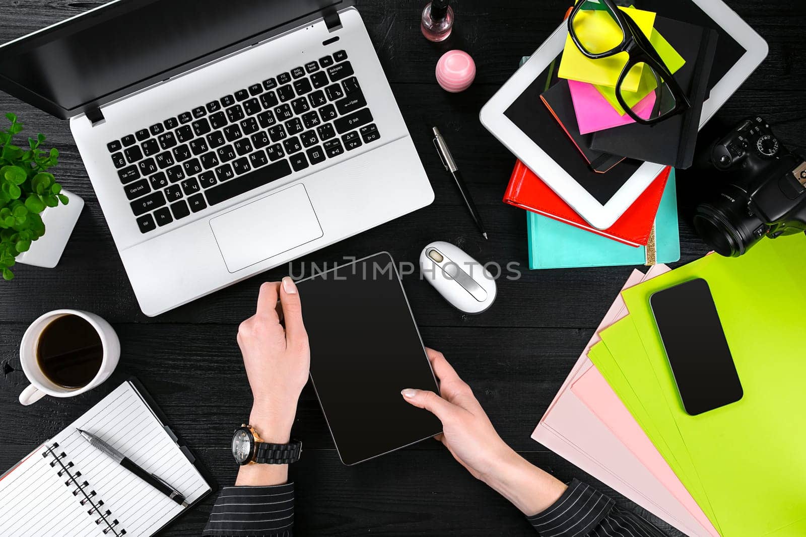 Overhead view of businesswoman working at computer in office. Place for your text. Ideal for blog. Flat lay. Black background