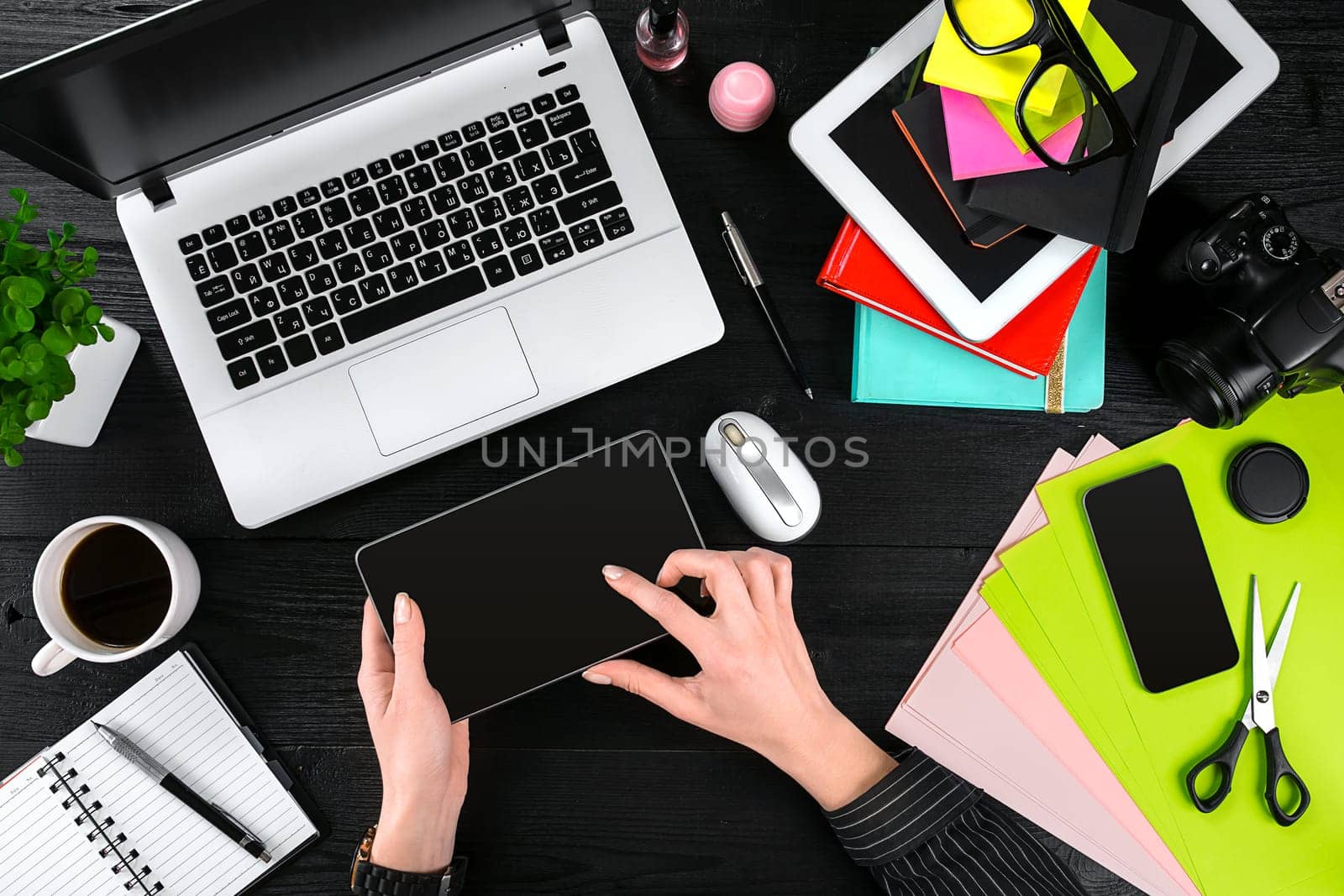 Overhead view of businesswoman working at computer in office. Place for your text. Ideal for blog. flat lay on black background