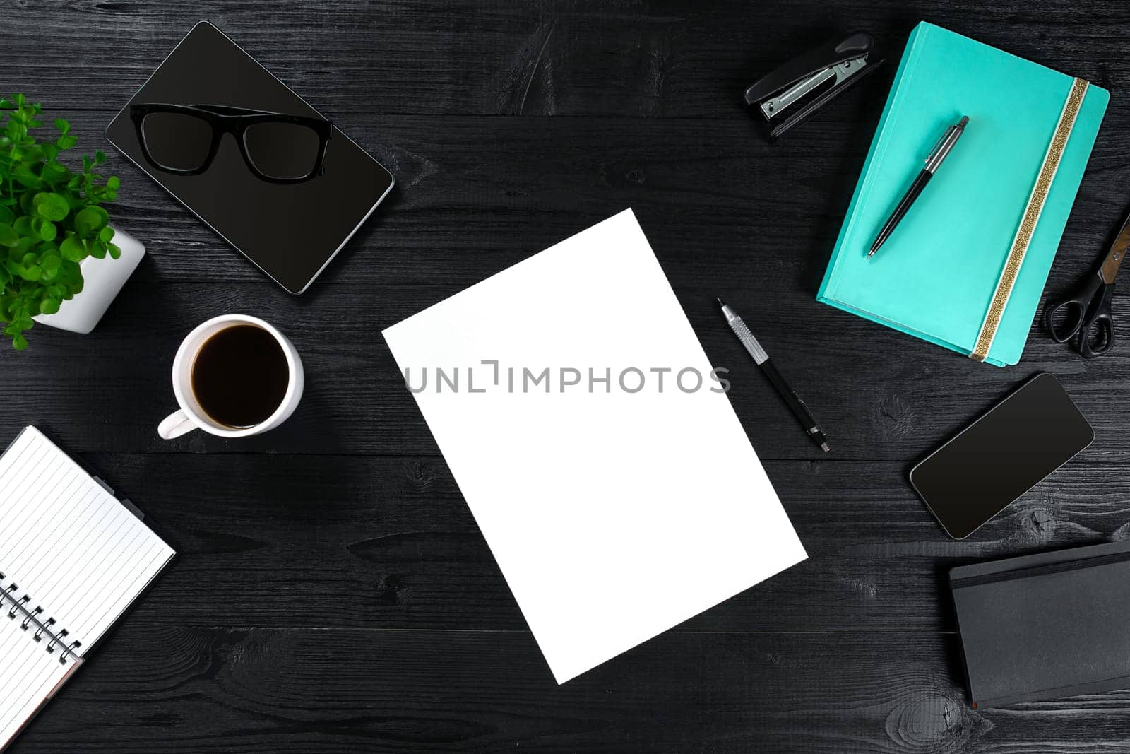 View from above with copy space office table , notebook with cup of coffee and Smart Phon. Women's table