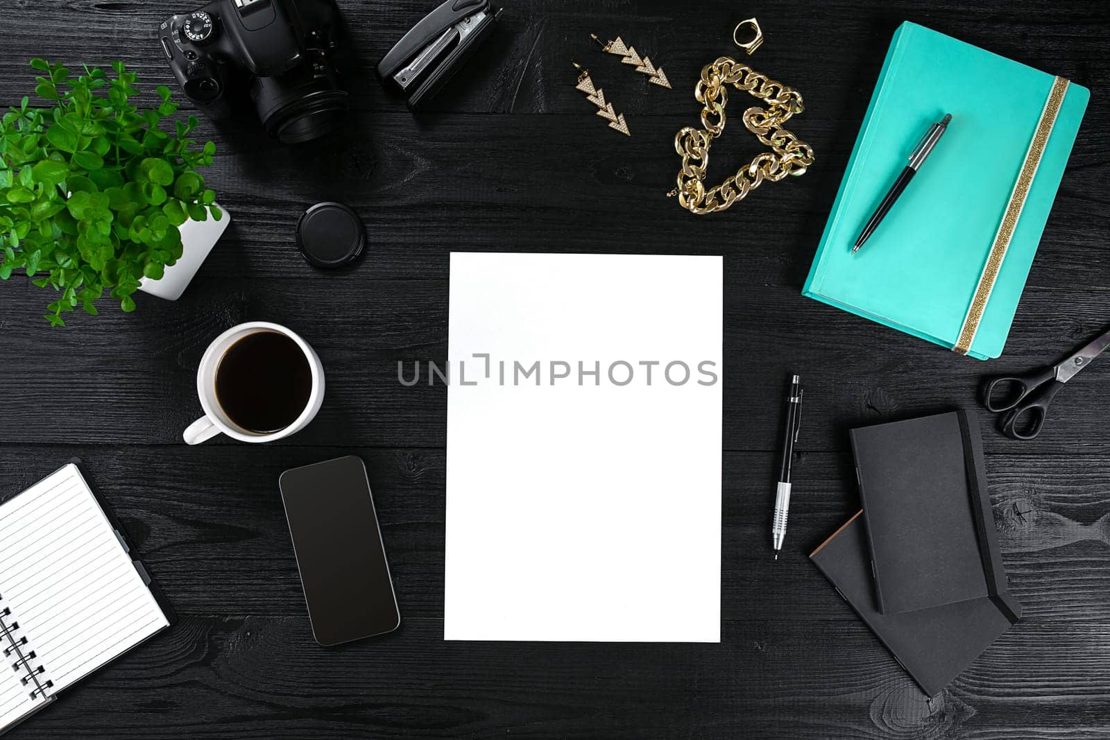 View from above with copy space office table , notebook with cup of coffee and Smart Phon. Women's table