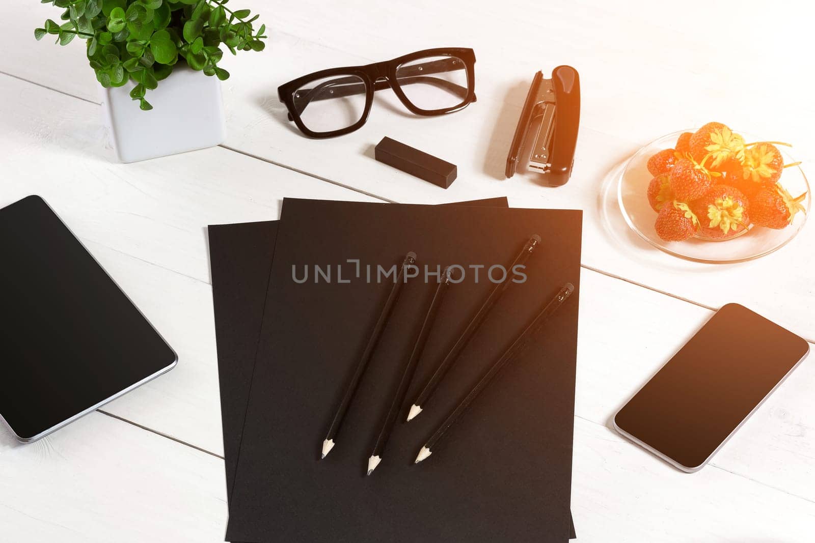 Modern workplace with digital tablet computer and mobile phone, cup of coffee, pen and empty sheet of paper. by nazarovsergey