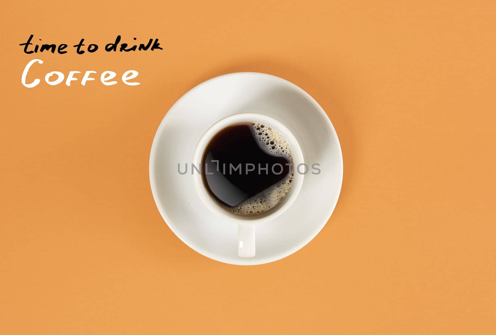 Top view of cup of black coffee and "Time to drink Coffee" lettering isolated on orange background by nazarovsergey