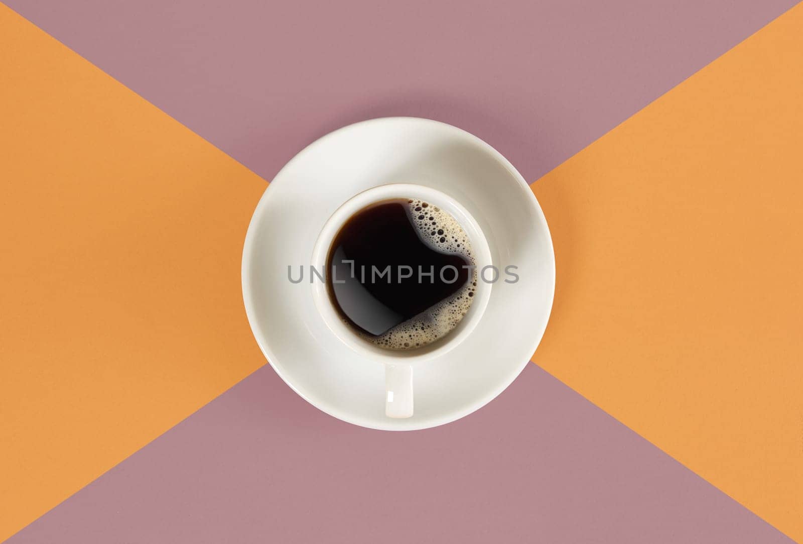 A cup of black coffee on orange and red background. View from above. Still life. Mock up. Flat lay. Copy space
