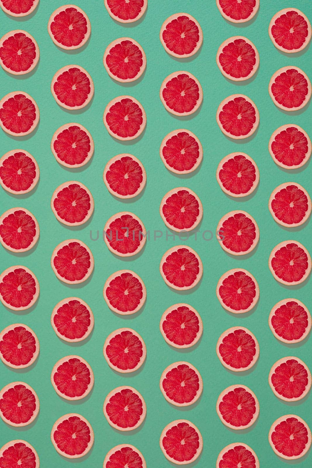 Grapefruit pattern isolated on blue background. Flat lay. Print