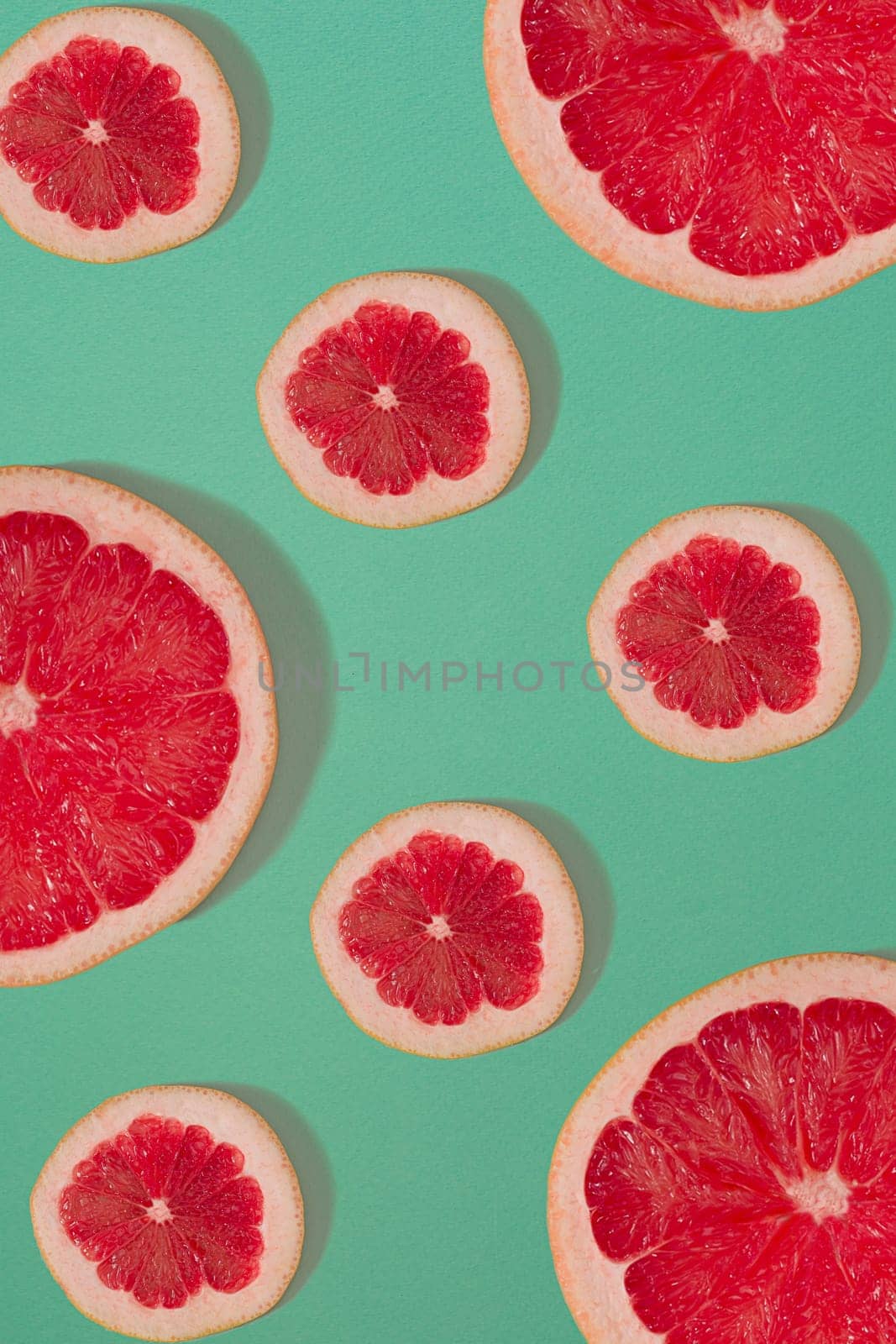 Grapefruit pattern isolated on blue background. Flat lay. Print