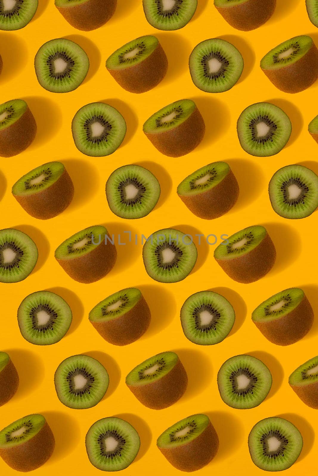 Colorful pattern of kiwi. Top view of the sliced kiwi. by nazarovsergey