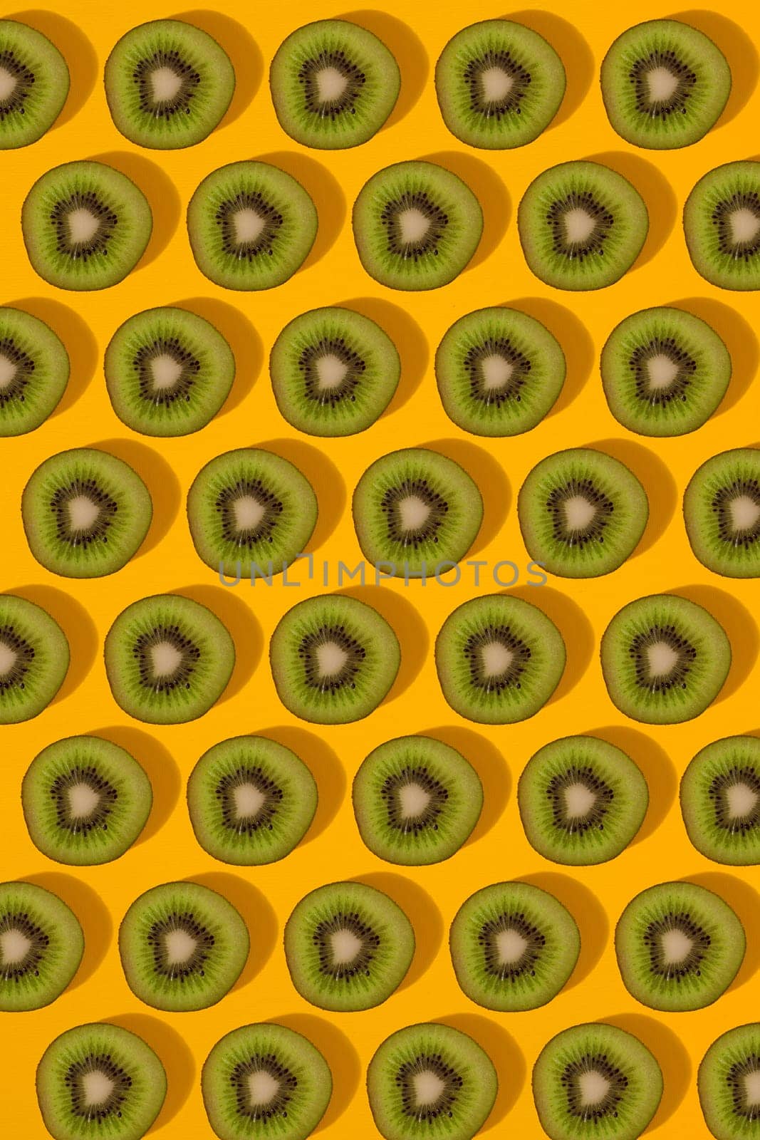 Colorful pattern of kiwi. Top view of the sliced kiwi. by nazarovsergey