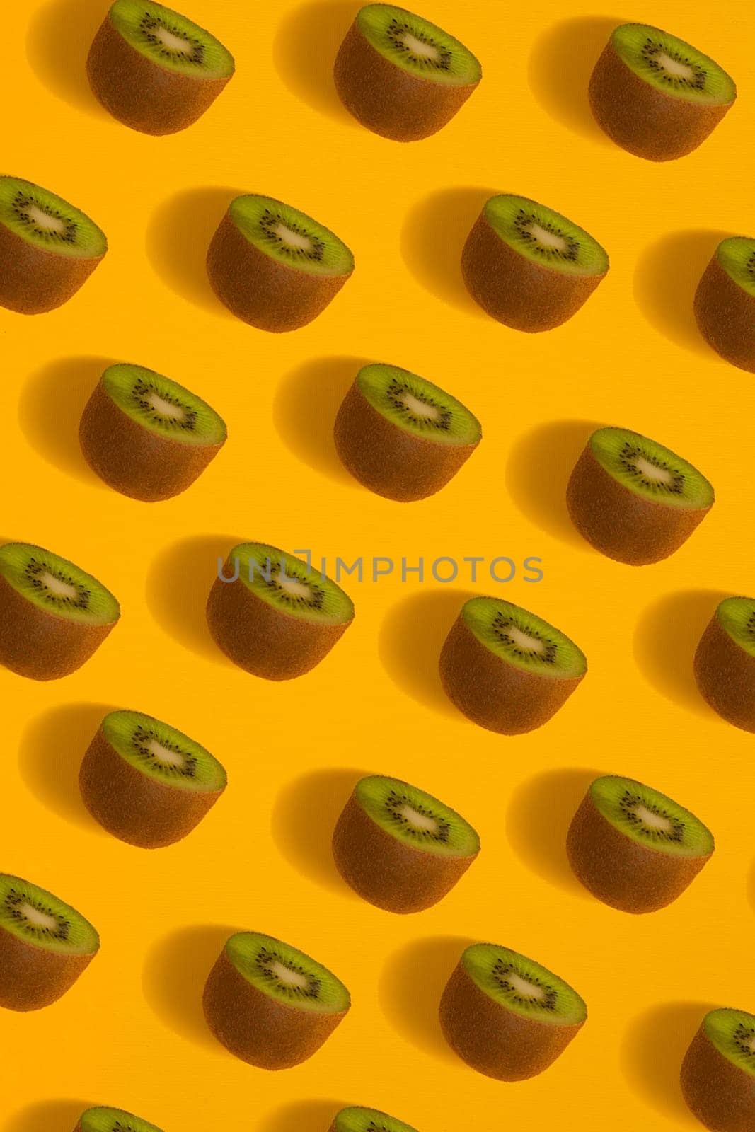 Colorful pattern of kiwi. Top view of the sliced kiwi. by nazarovsergey