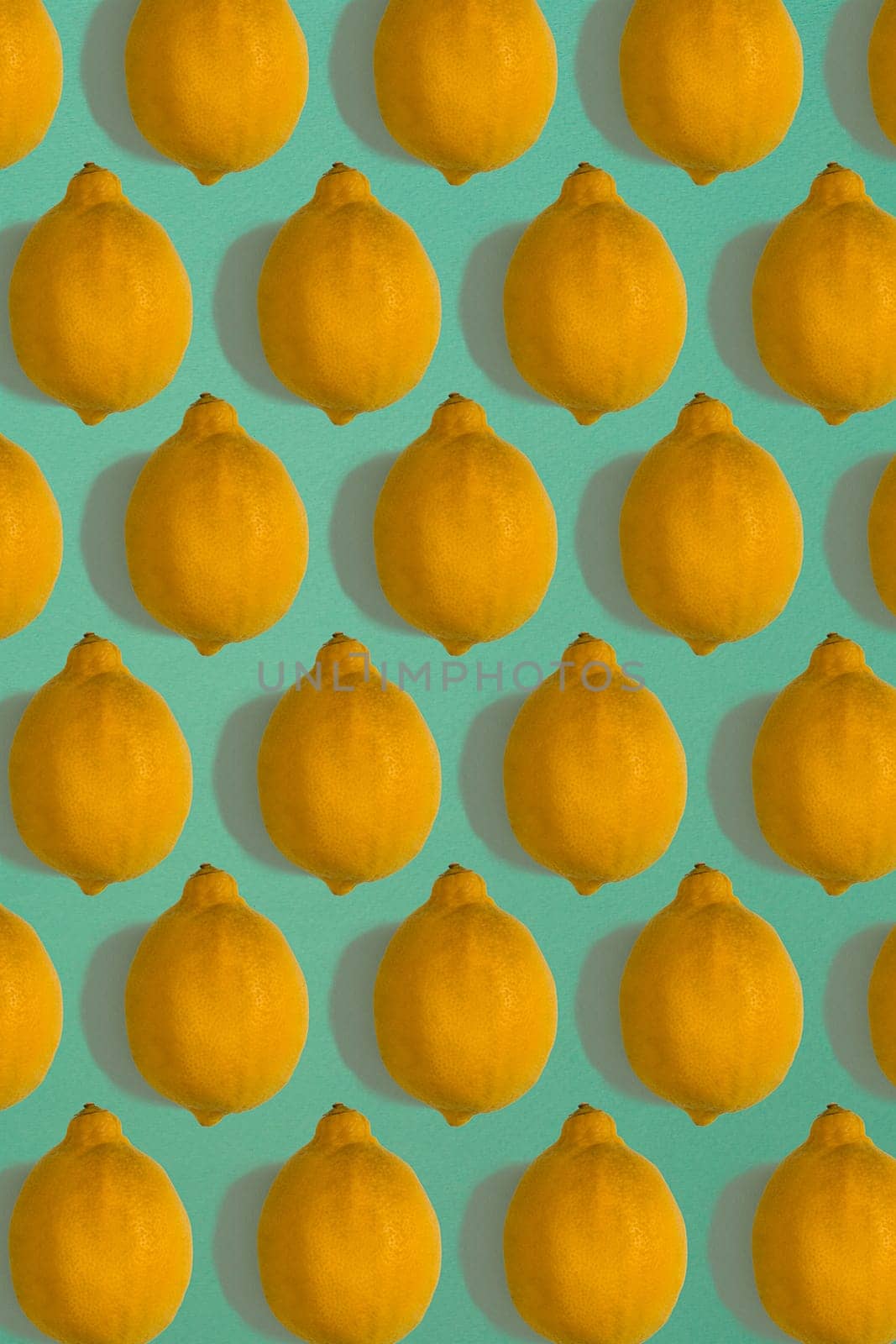 Lemon pattern isolated on blue background. Flat lay. Print