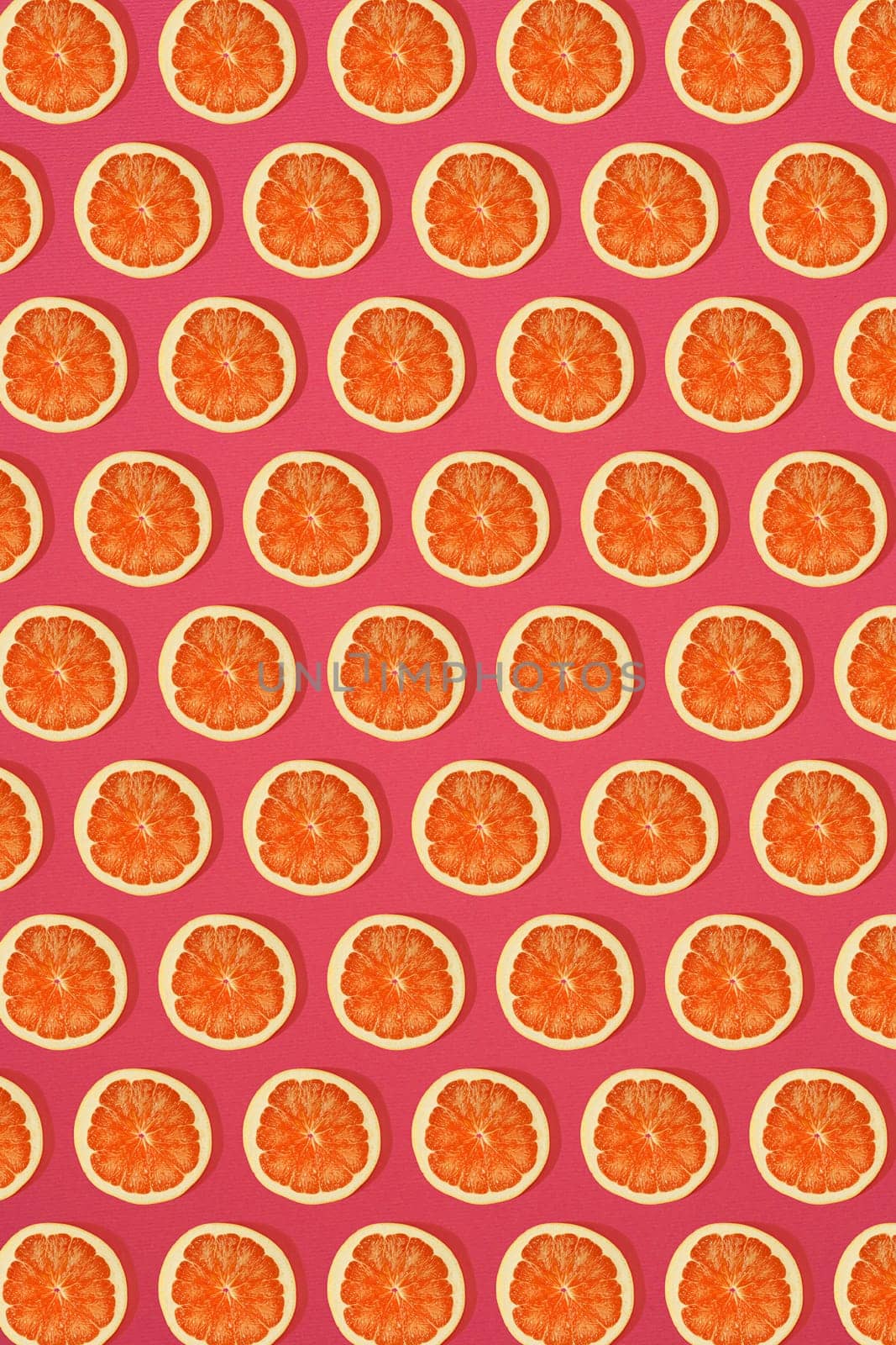 Grapefruit pattern on pink background. Minimal flat lay concept. Print
