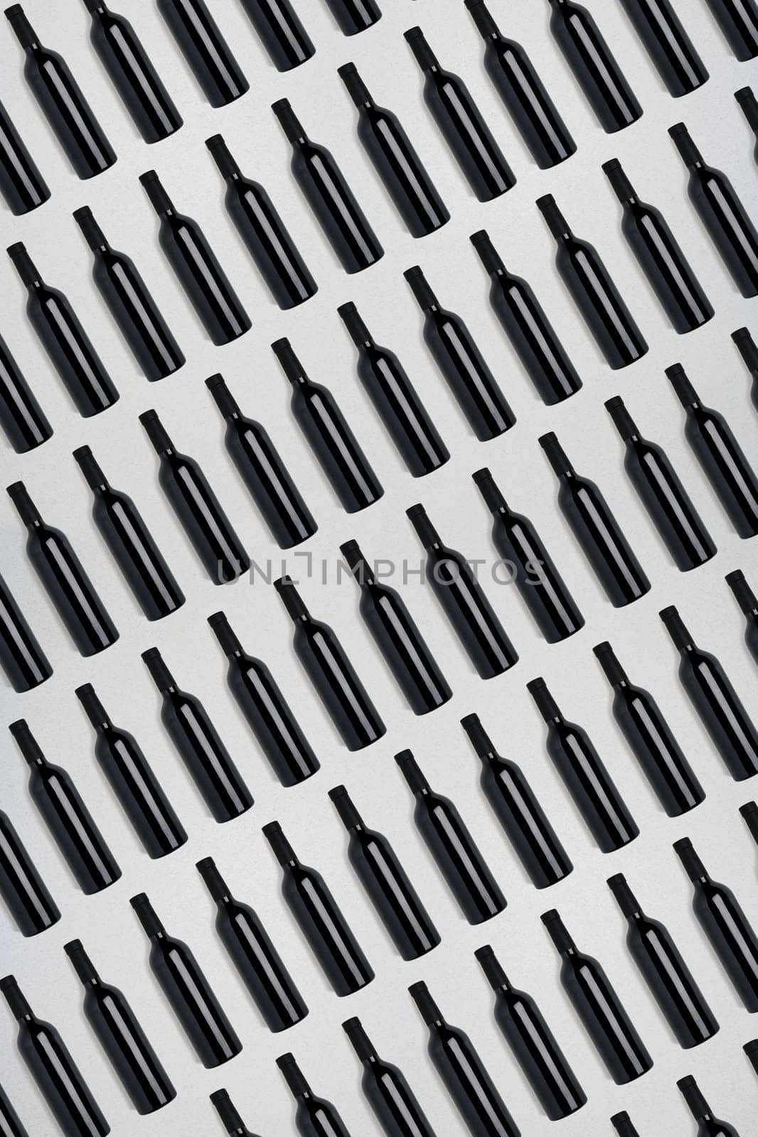 Dark wine bottles. Creative dark and textured abstract background. by nazarovsergey