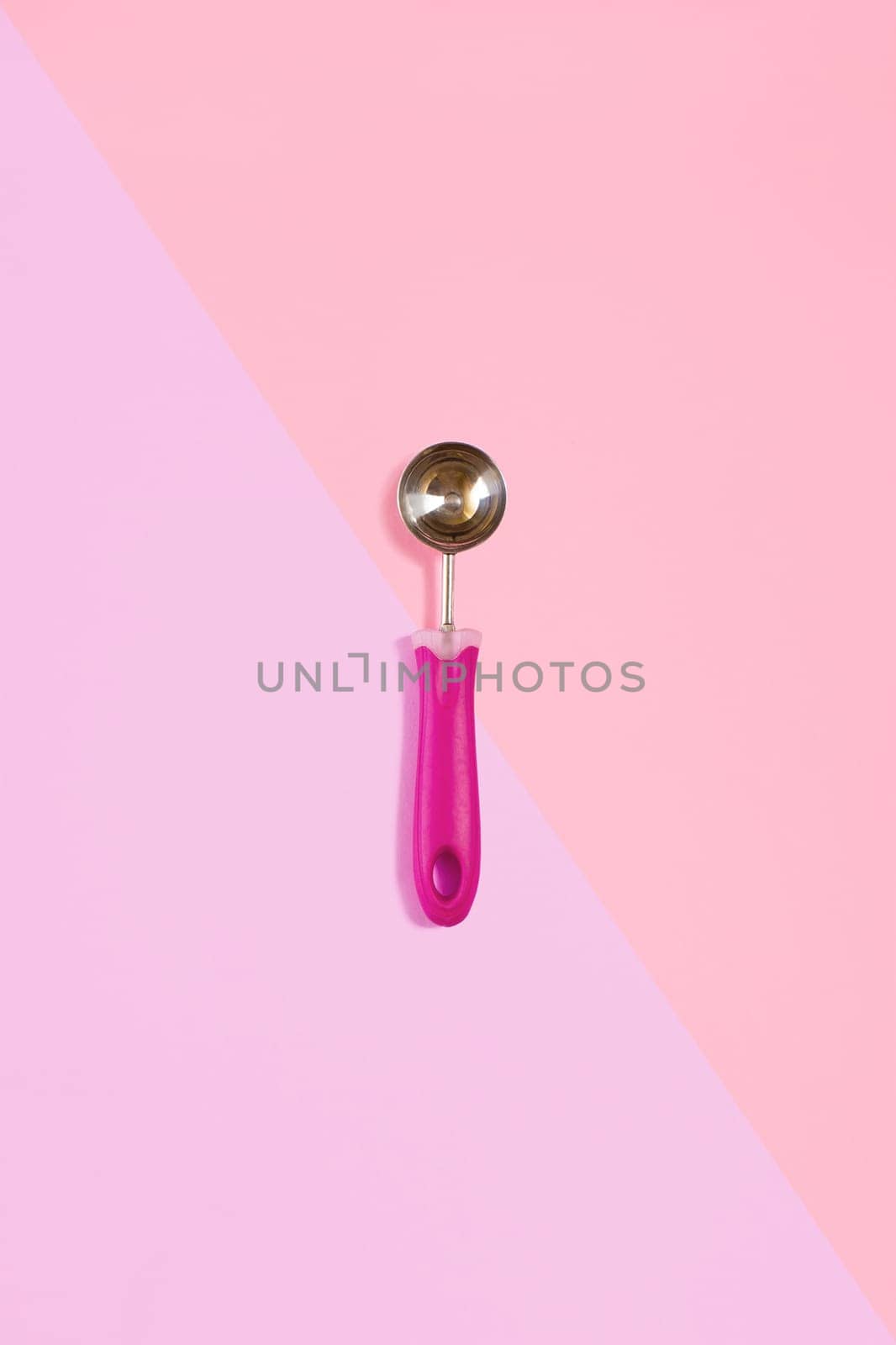 Ice cream scoop isolated on pink. Top view. Copy space. Flat lay