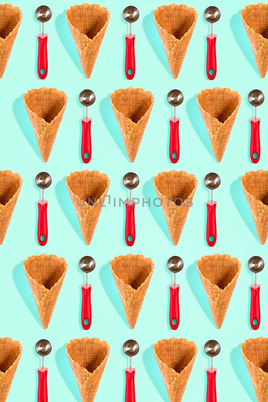 Ice cream cones pattern. Turquoise background. Top view. Flat lay by nazarovsergey