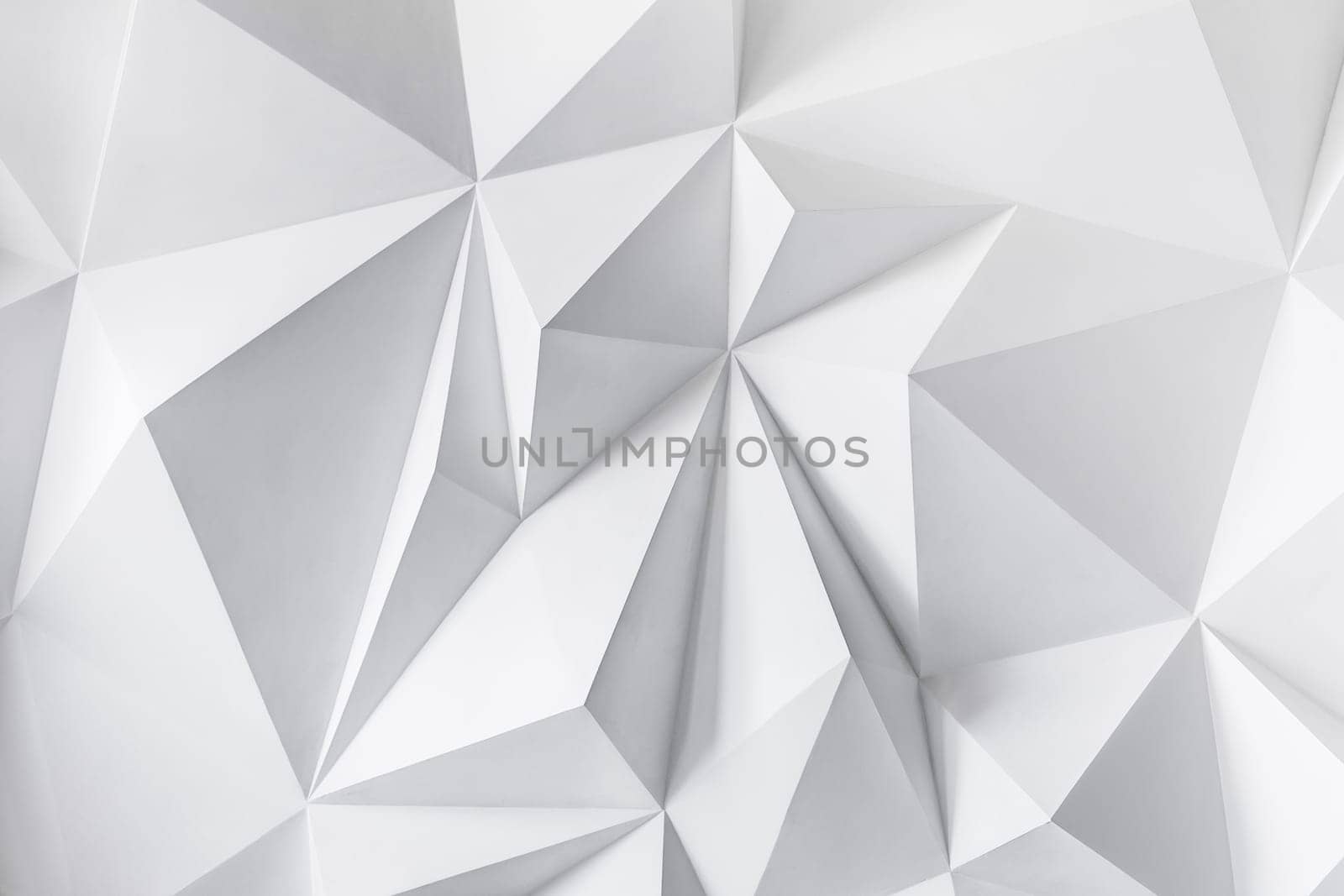 Photo of abstract background of polygons on white background. White texture.