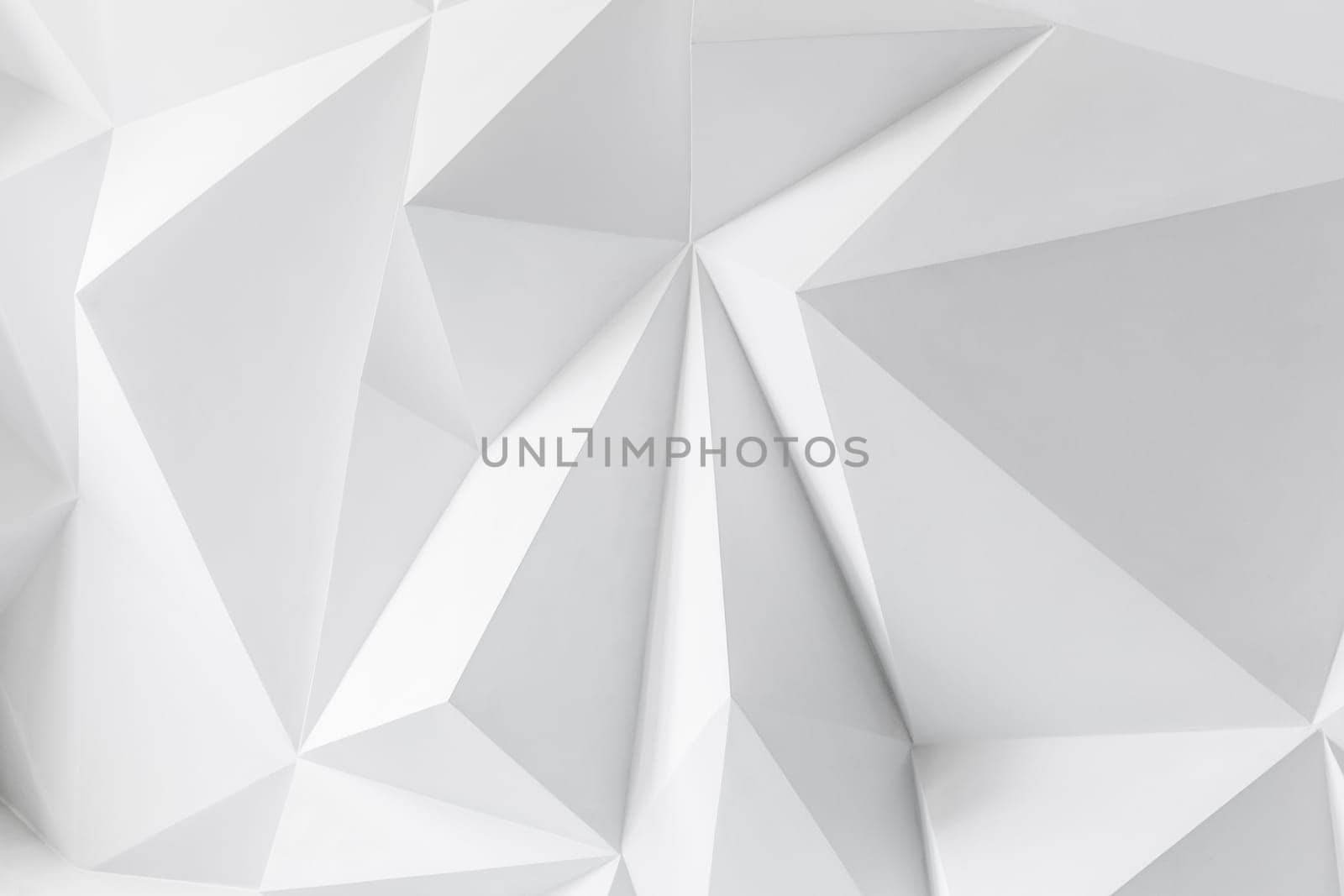 Photo of abstract background of polygons on white background. White texture.