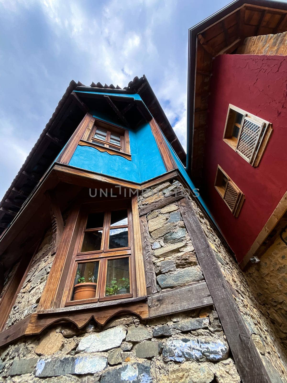 Traditional Ottoman house in blue and red. Old Ottoman village, UNESCO World Heritage Site. Old wooden mansion of Turkish architecture. Wooden Ottoman mansion