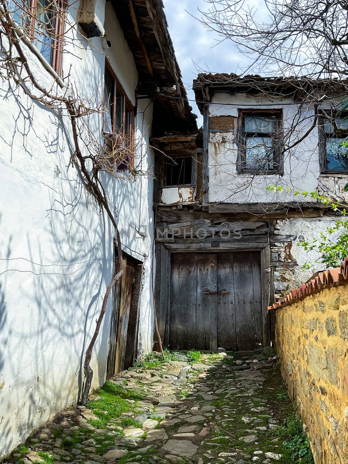 Cumalikizik village is a 700 years old Ottoman village in Turkey. Old Ottoman village in Bursa city, Turkey. Narrow street with old Ottoman houses
