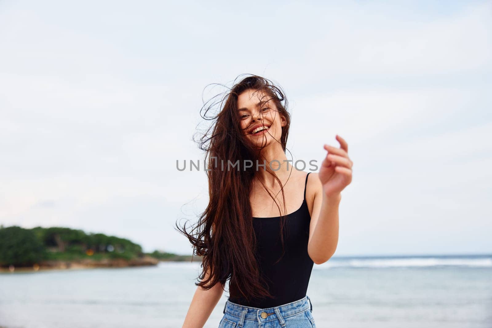 woman young ocean sea sunset travel freedom activity lifestyle active summer leisure beach bikini running happiness smile person sun hair water