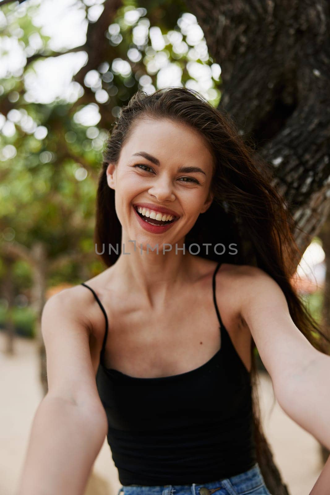 nature woman lifestyle happiness relaxation sea paradise happy tree playing smiling summer vacation relax fitness ocean hat sky sitting beautiful girl