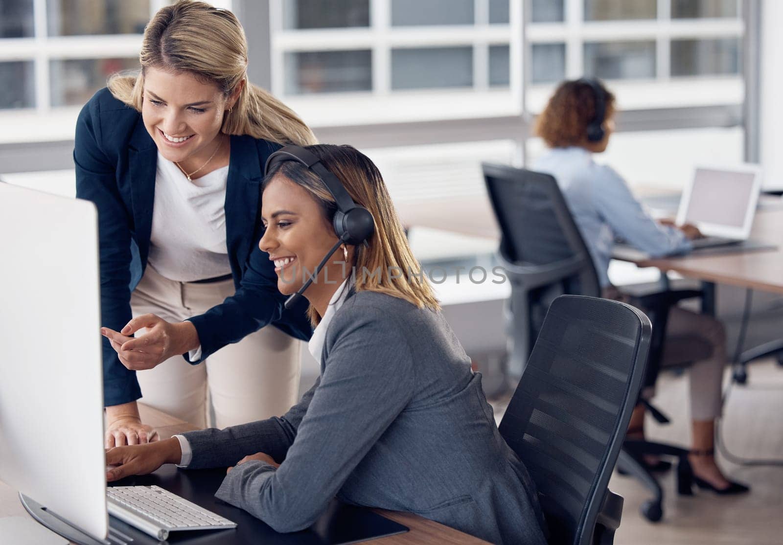 Call center woman, computer and coach for learning, reading and customer support with happiness at job. Indian telemarketing consultant, mentor and crm training with pointing at monitor with manager.