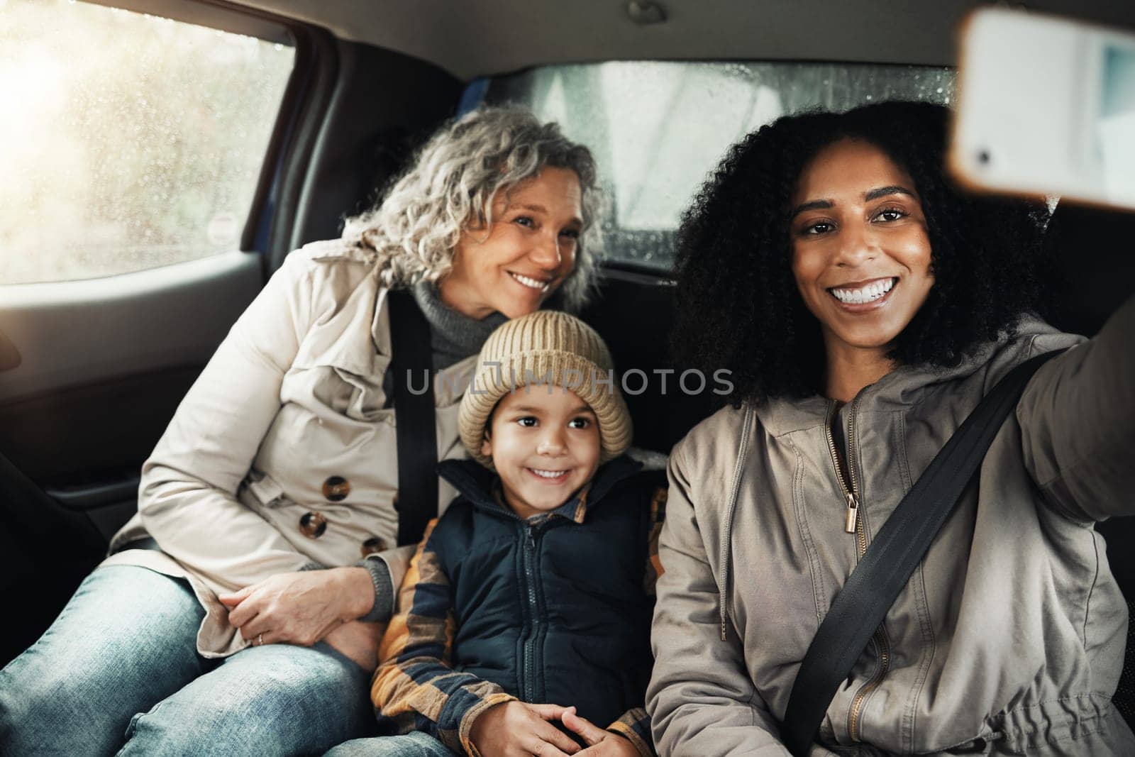 Selfie, smile and family on a road trip in a car for bonding, quality time and a getaway together. Happy, travel and mother, grandmother and a child taking a photo on vacation for social media.