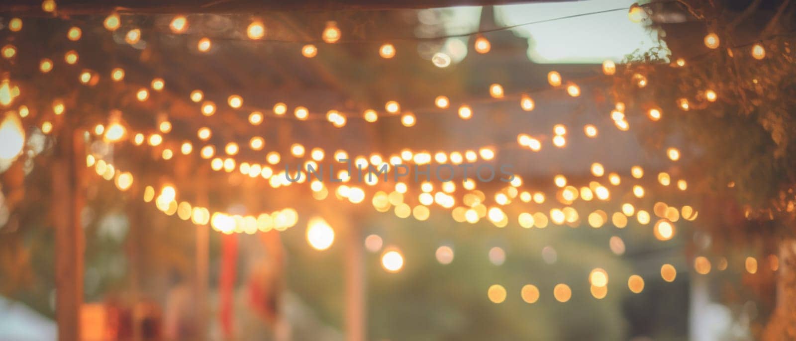 Abstract Blurred image of Night Festival in garden with bokeh for background usage. Concept of vintage tones.