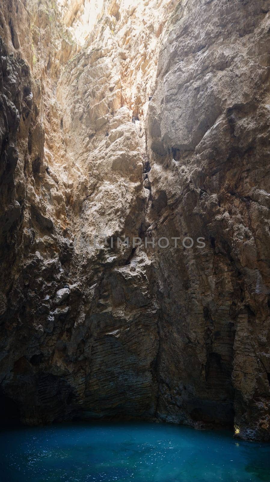 Turquoise-green lake in the Proval cave, on the southern slope of mount Mashuk. Proval Cave in Pyatigorsk. Lake with turquoise water in a cave. Underground lake Proval. failure in piatigorsk.