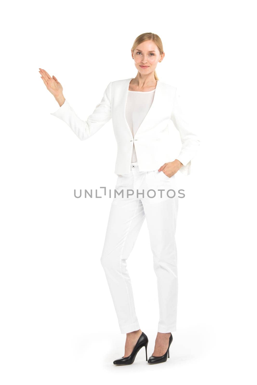 Businesswoman pointing with hand palm at empty copy space, studio isolated on white background, full length portrait