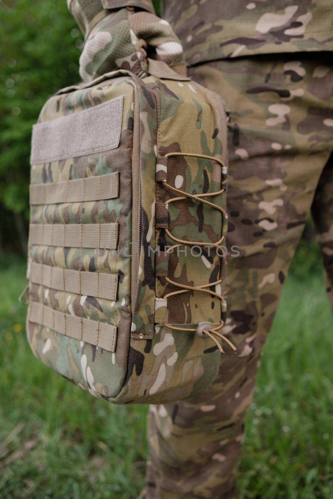 Close-up of Tactical Backpack Details on Soldier in Forest