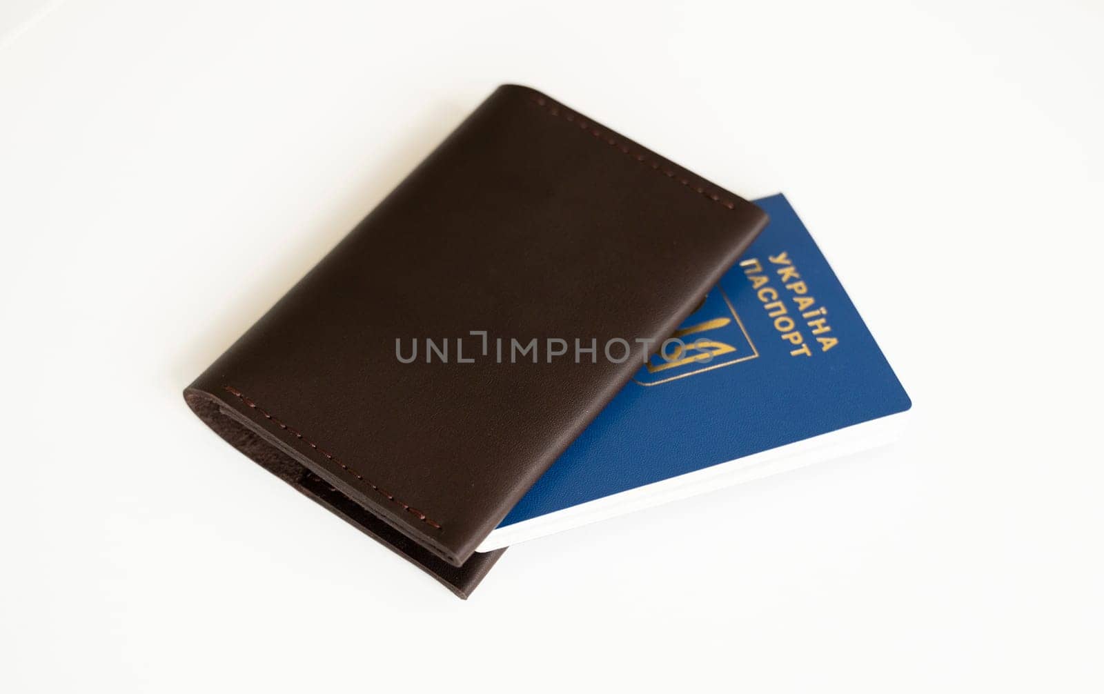 Ukrainian biometric passport id with a genuine leather cover on a white background